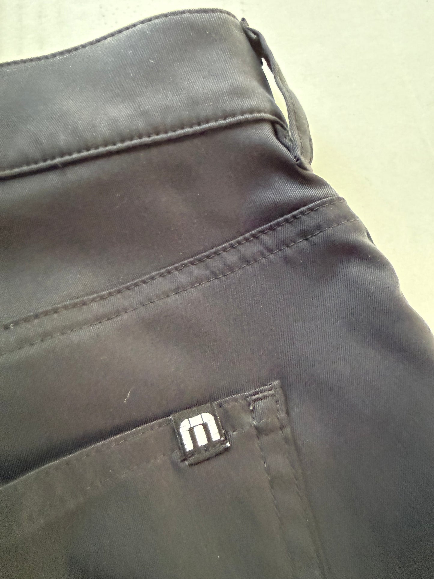 TravisMathew style number tag