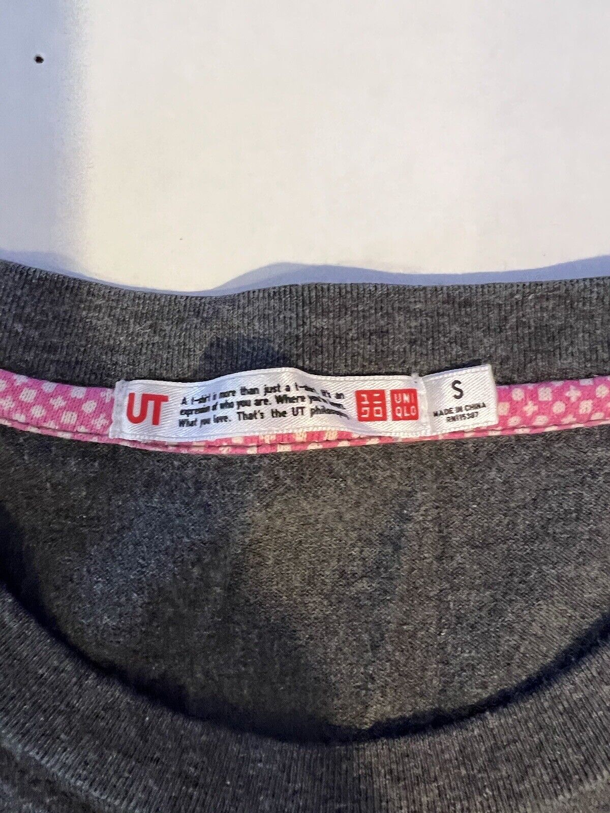UNIQLO Bomber Man RARE Short sleeve shirt Mens Small Solid Front Graphic Hit - thriftgoblin