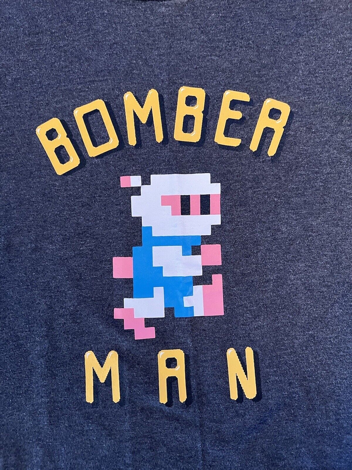 UNIQLO Bomber Man RARE Short sleeve shirt Mens Small Solid Front Graphic Hit - thriftgoblin