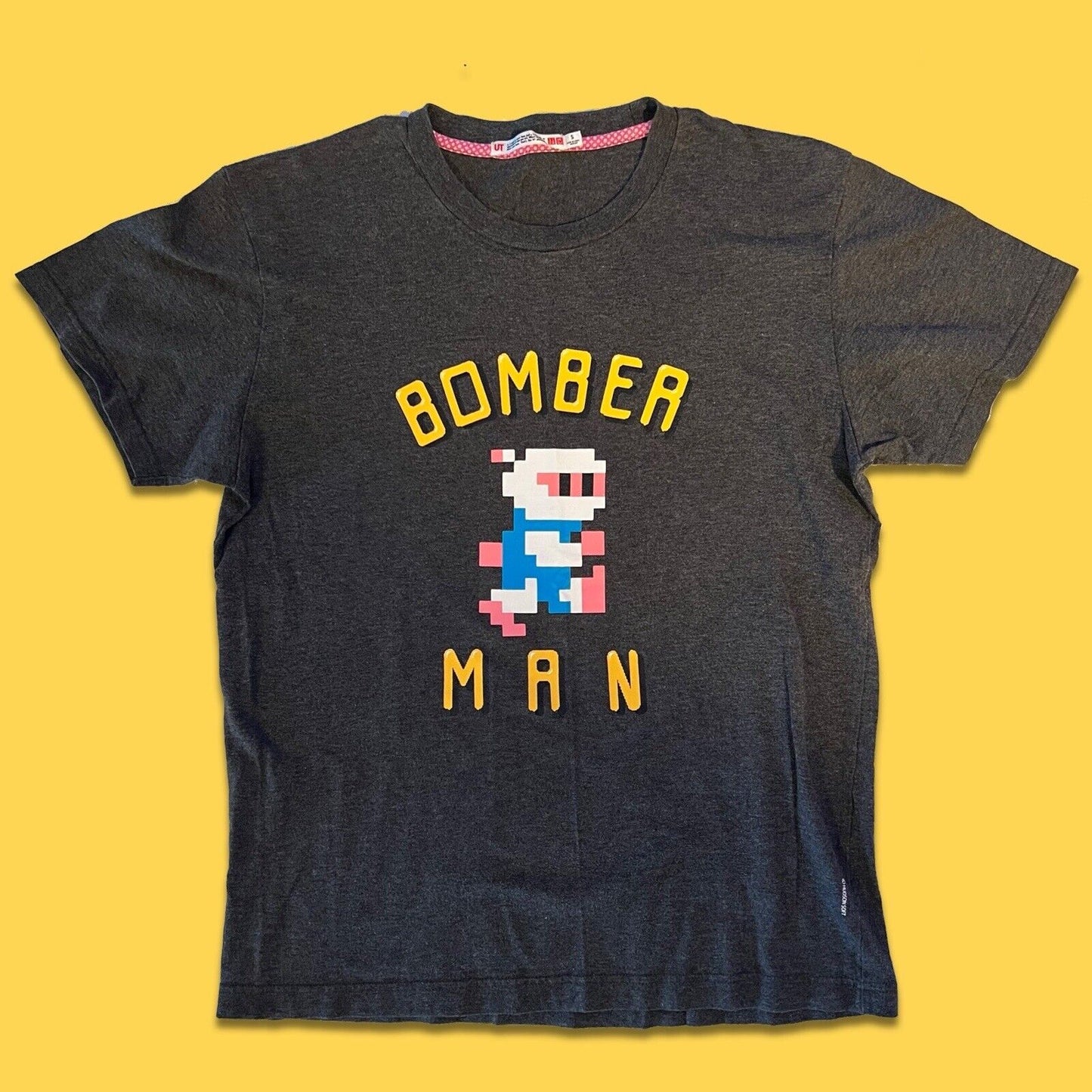 UNIQLO Bomber Man RARE Short sleeve shirt Mens Small Solid Front Graphic Hit - thriftgoblin