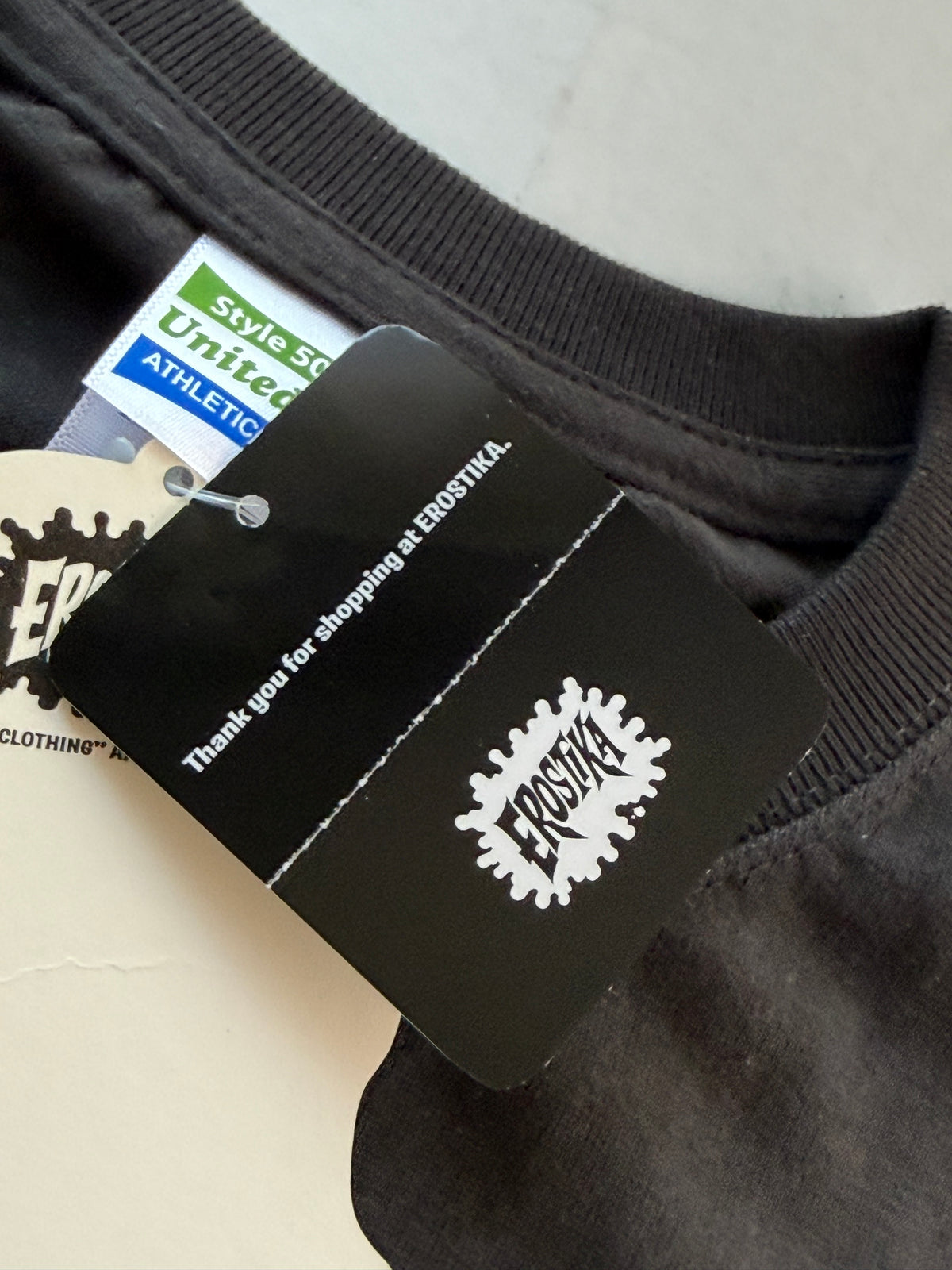 United Athle neck tag and Erostika thank you tag