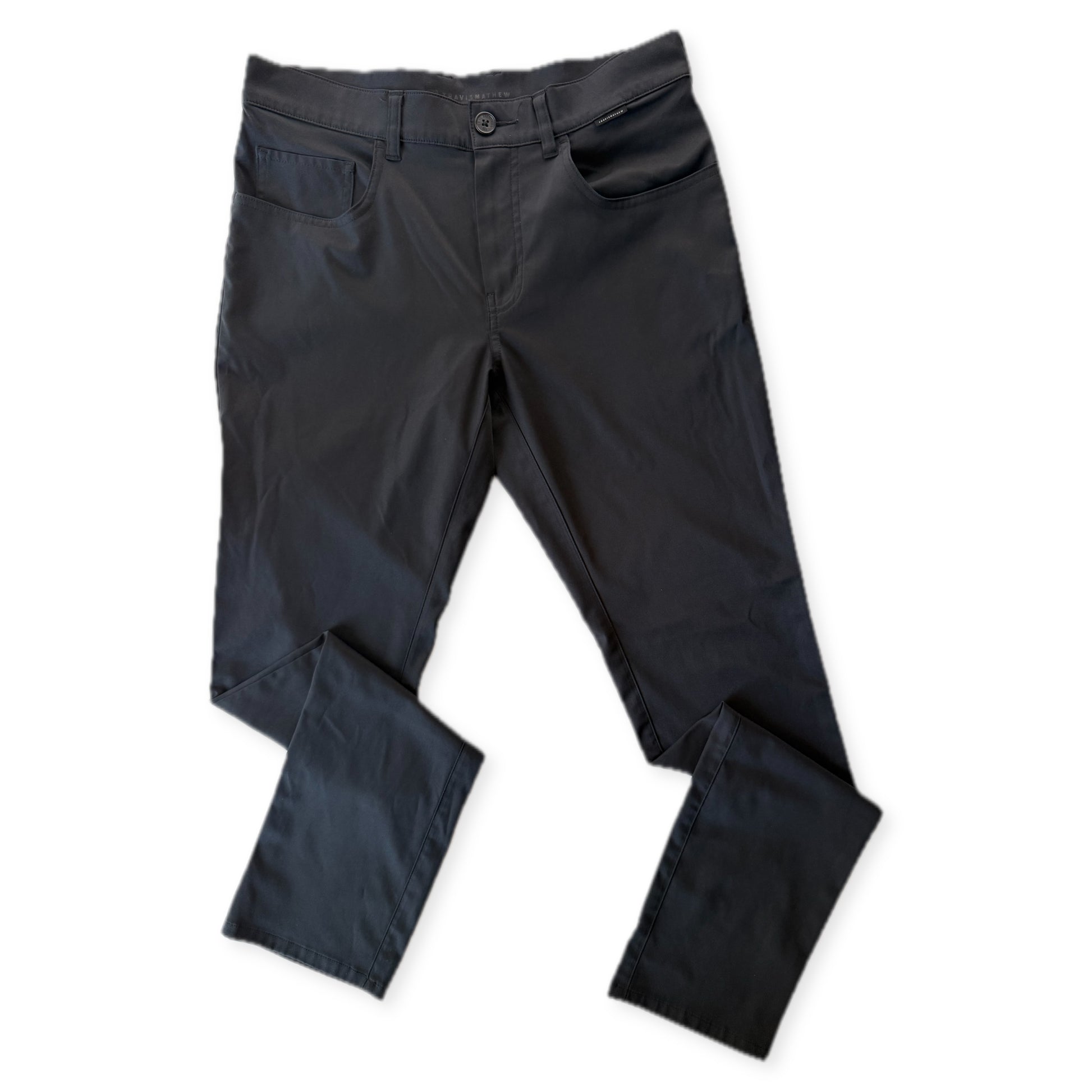 TravisMathew black golf pants, front, white background