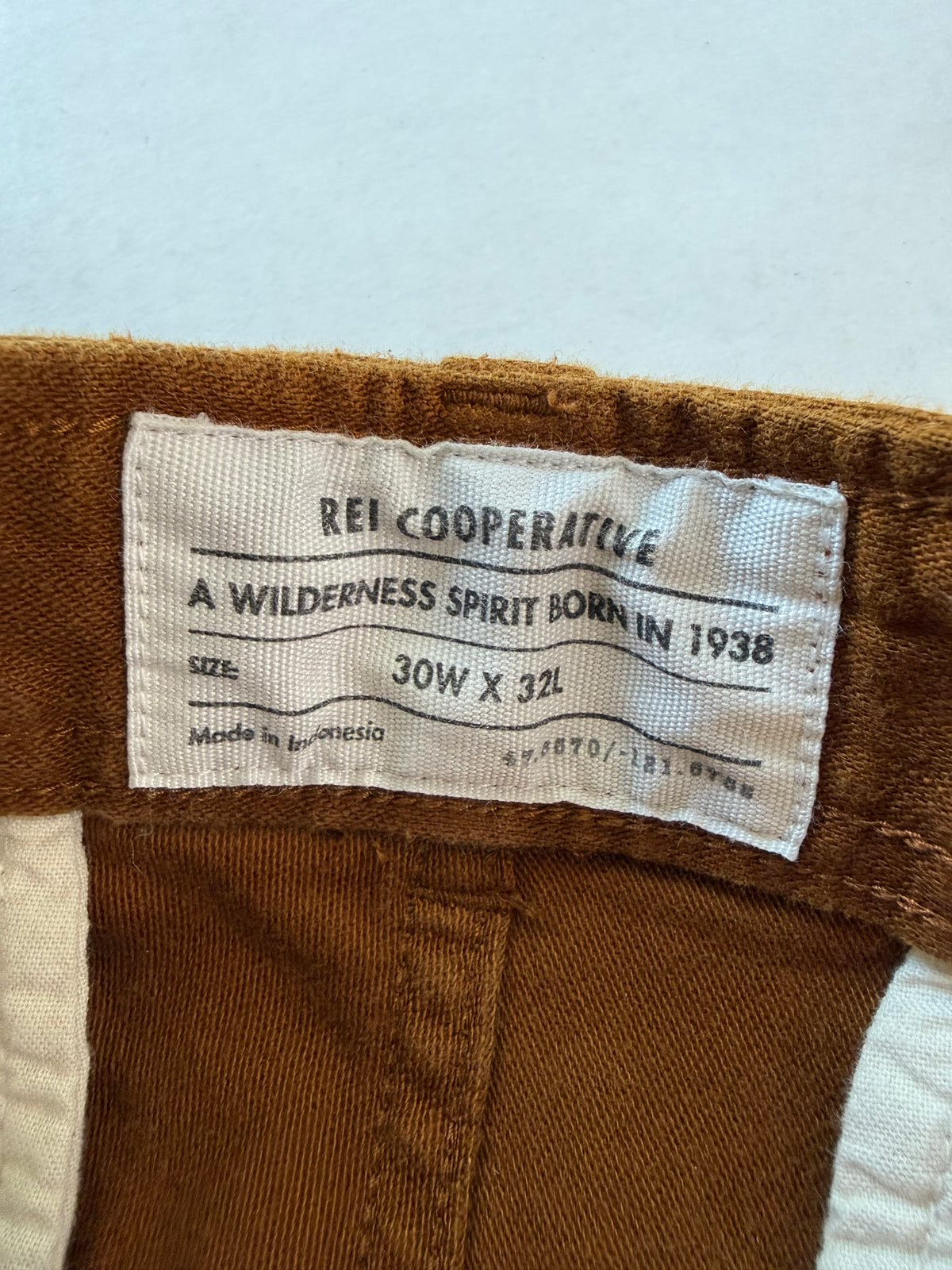 REI Co-op pants waist drawstring and snap detail