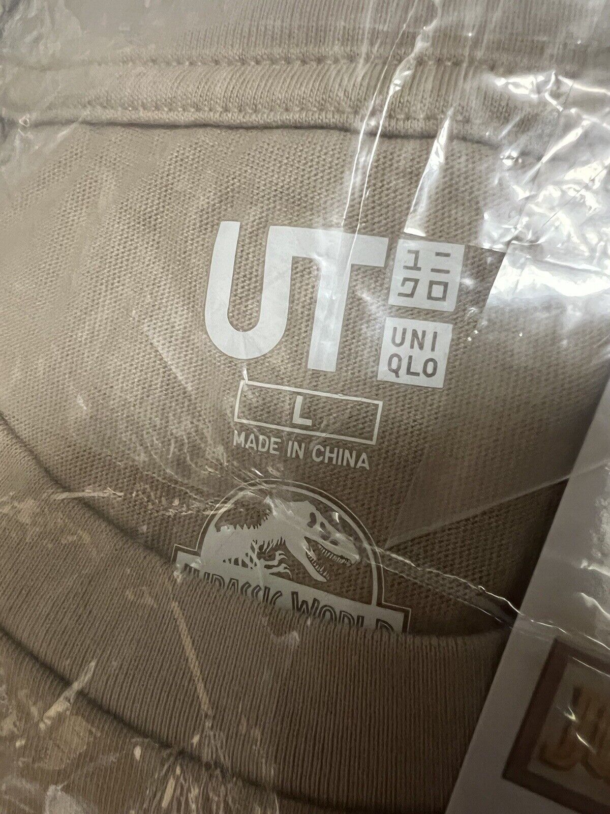 Jurassic World Collab Hajime Sorayama Uniqlo Sand Mens T-Shirt L Stegosaurus - thriftgoblin